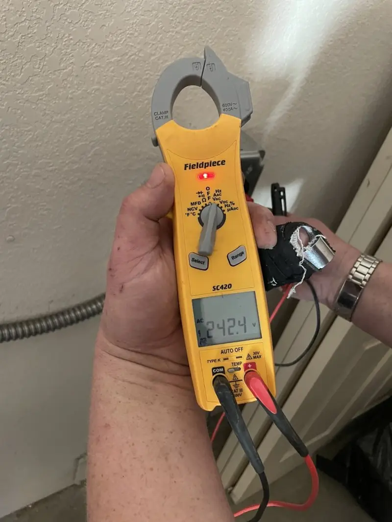 Voltage testing with clamp meter during Electrical Installation Services in Wildwood